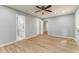 Bedroom featuring hardwood floors with a walk-in closet and ensuite bathroom at 7074 Babbling Brook Dr, Jonesboro, GA 30236