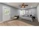 Bedroom with natural light, ceiling fan, and neutral decor at 7074 Babbling Brook Dr, Jonesboro, GA 30236