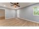 Bedroom featuring a ceiling fan, natural light from a window, and an exterior door at 7074 Babbling Brook Dr, Jonesboro, GA 30236