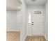 Bright entryway with a decorative front door, light walls, and modern flooring at 7074 Babbling Brook Dr, Jonesboro, GA 30236