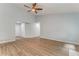 Spacious living room with hardwood floors and a ceiling fan at 7074 Babbling Brook Dr, Jonesboro, GA 30236