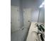 Bathroom featuring double sinks, framed mirror, and white cabinets at 955 Tributary Way, Dacula, GA 30019