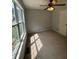 Bedroom featuring carpet, large window and ceiling fan at 955 Tributary Way, Dacula, GA 30019