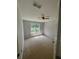 Bedroom with ceiling fan, light colored carpet and window at 955 Tributary Way, Dacula, GA 30019