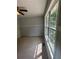 Bright bedroom with a window and ceiling fan at 955 Tributary Way, Dacula, GA 30019
