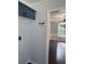 Mudroom area with dark cabinets, key rack and hardwood floors leading to dining area at 955 Tributary Way, Dacula, GA 30019