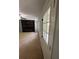 Open-concept living area features neutral carpet and a stylish fireplace at 955 Tributary Way, Dacula, GA 30019
