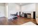 This media room has hardwood floors, a movie screen, and a desk at 10035 River Rock Dr, Roswell, GA 30076