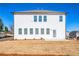Rear view showcases a new build home featuring ample windows, door access and expansive backyard at 1795 Fulmont Cir, Mableton, GA 30126