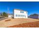 Back exterior of home boasts large windows, a manicured lawn, and a private setting at 1795 Fulmont Cir, Mableton, GA 30126
