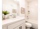 Bright bathroom includes a vanity, mirror, and tiled shower with tub at 1795 Fulmont Cir, Mableton, GA 30126