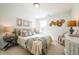 Light-filled bedroom showcases tasteful decor, complemented by a comfortable bed and plush carpeting at 1795 Fulmont Cir, Mableton, GA 30126