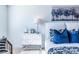 Stylish bedroom with light walls, decorative pillows, and ample natural light that creates a serene ambiance at 1795 Fulmont Cir, Mableton, GA 30126