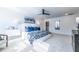 Spacious primary bedroom with a plush carpet, a white bed with blue decorative pillows, and modern decor at 1795 Fulmont Cir, Mableton, GA 30126