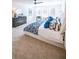 Bright bedroom featuring large windows, a ceiling fan, and a comfortable bed with stylish blue and white bedding at 1795 Fulmont Cir, Mableton, GA 30126