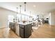 Modern kitchen with a large island, stainless steel appliances, and an open view to the living area at 1795 Fulmont Cir, Mableton, GA 30126
