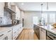 Modern kitchen featuring white cabinets, stainless steel appliances, and a center island with seating at 1795 Fulmont Cir, Mableton, GA 30126