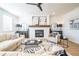 Cozy living room featuring a fireplace, hardwood floors, comfortable seating, and contemporary decor at 1795 Fulmont Cir, Mableton, GA 30126