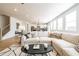 Bright and airy living room featuring recessed lighting, a large sofa, and an open-concept design at 1795 Fulmont Cir, Mableton, GA 30126