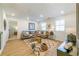 Inviting living room featuring a large sectional sofa, a stylish area rug, and plenty of natural light at 1795 Fulmont Cir, Mableton, GA 30126