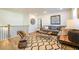 Stylish living room with comfortable seating, decorative rug, and modern lighting at 1795 Fulmont Cir, Mableton, GA 30126