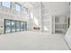 Spacious living area with high ceilings and accordion glass doors ready for finishing touches at 2395 Kilgore Road (Lot 7) Rd, Buford, GA 30519