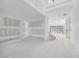 Spacious living area with accordion glass doors and loft area ready for finishing touches at 2395 Kilgore Road (Lot 7) Rd, Buford, GA 30519
