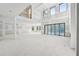 Spacious living area with high ceilings and accordion glass doors for indoor-outdoor living at 2395 Kilgore Road (Lot 7) Rd, Buford, GA 30519