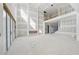 Spacious living area with high ceilings and accordion glass doors ready for personalization at 2395 Kilgore Road (Lot 7) Rd, Buford, GA 30519