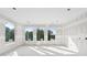 Sunlight streams into the expansive living area through large windows, with walls in pre drywall stage at 2395 Kilgore Road (Lot 7) Rd, Buford, GA 30519