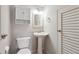 This bathroom features a pedestal sink, storage, and bright lighting at 290 Lakemoore Ne Dr # C, Atlanta, GA 30342