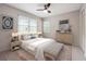 Bedroom featuring a large window, fan, and stylish decor at 290 Lakemoore Ne Dr # C, Atlanta, GA 30342