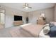 Comfortable bedroom with soft carpet, fan, and modern furniture at 290 Lakemoore Ne Dr # C, Atlanta, GA 30342
