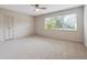 Bedroom with carpet and a large window allowing for natural light at 290 Lakemoore Ne Dr # C, Atlanta, GA 30342