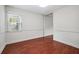 Bright, empty dining room featuring hardwood floors and natural light from a window at 290 Lakemoore Ne Dr # C, Atlanta, GA 30342