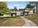 Inviting townhouse with landscaped front yard, walkway, and well-maintained exterior at 290 Lakemoore Ne Dr # C, Atlanta, GA 30342