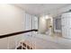 Hallway featuring large mirror and access to multiple rooms at 290 Lakemoore Ne Dr # C, Atlanta, GA 30342