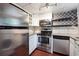 Modern kitchen with stainless steel appliances, granite countertops, and white cabinets at 290 Lakemoore Ne Dr # C, Atlanta, GA 30342