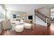 Bright living room with a staircase, hardwood floors, neutral paint, and modern furnishings at 290 Lakemoore Ne Dr # C, Atlanta, GA 30342