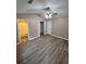 Large bedroom with en-suite bathroom and a walk-in closet, featuring wood-look flooring and neutral paint at 5538 Pineridge Ct, Forest Park, GA 30297