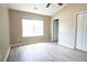 Bright bedroom featuring neutral paint, ceiling fan and hardwood floors at 5538 Pineridge Ct, Forest Park, GA 30297