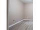 Bedroom with light wood-look floors and neutral wall color at 5538 Pineridge Ct, Forest Park, GA 30297