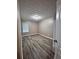 Cozy bedroom with wood-look flooring, neutral paint, and a bright window at 5538 Pineridge Ct, Forest Park, GA 30297