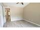 This spacious bedroom features natural light and hardwood floors at 5538 Pineridge Ct, Forest Park, GA 30297