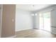 Bright dining area with pendant lighting and sliding door to outdoor space at 5538 Pineridge Ct, Forest Park, GA 30297