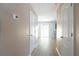 Hallway leading to dining area with sliding door and granite counters at 5538 Pineridge Ct, Forest Park, GA 30297