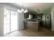 Open-concept kitchen with stainless steel appliances and sliding glass door at 5538 Pineridge Ct, Forest Park, GA 30297