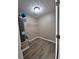 Laundry room with wood-look floors, neutral paint, and utility connections at 5538 Pineridge Ct, Forest Park, GA 30297