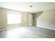 Spacious living room with neutral paint, luxury vinyl plank flooring, and bright natural light at 5538 Pineridge Ct, Forest Park, GA 30297