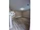 Open living room with hardwood flooring and neutral paint at 5538 Pineridge Ct, Forest Park, GA 30297
